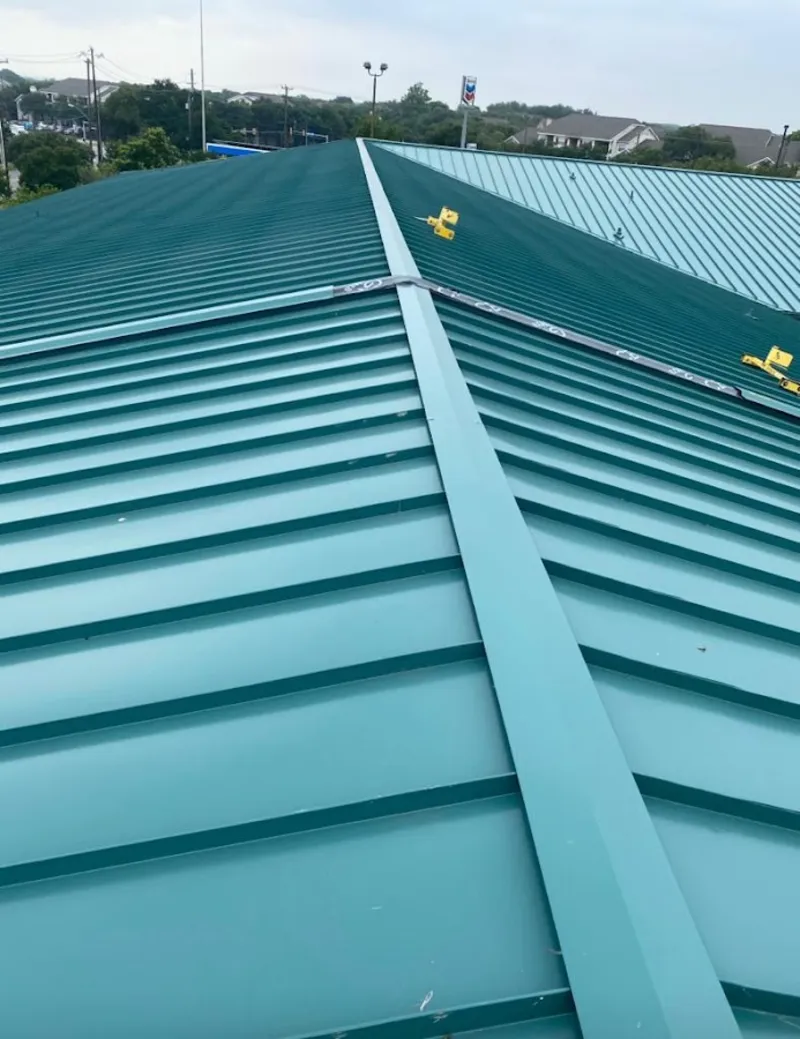 Green commercial metal roof ridge and valley for Metal Roof Repair in Belchertown